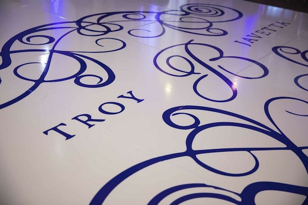 custom white dance floor with a navy blue monogram