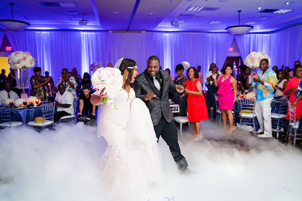 bride and groom entering their Doko Manor ballroom and dancing on a cloud of smoke