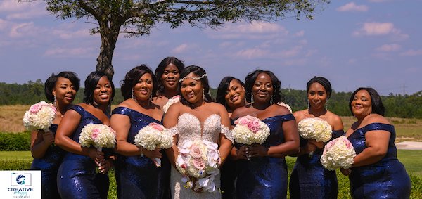 bridal party wearing shimmering Navy blue sequin dresses posing with bride