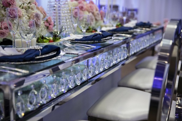 crystals hanging on a long mirrored dining table at a sophisticated South Carolina wedding