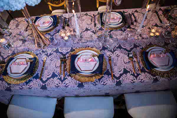 luxurious North Charleston wedding reception set with gold charger plates and eclectic gold rimmed china