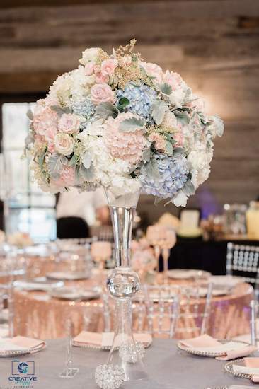 blush and dusty blue centerpiece at a catawba falls event center wedding