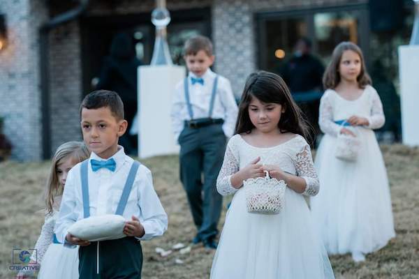 ring bearers and flower girls in dusty blue